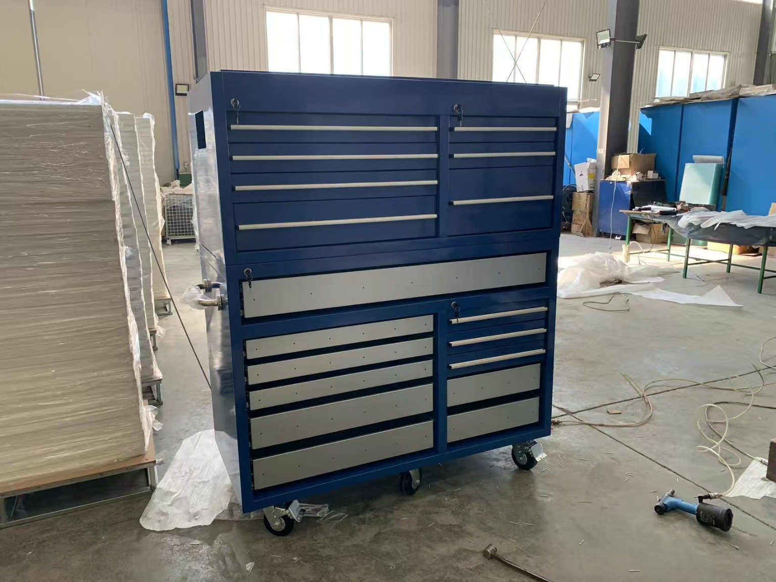 Blue stackable rolling tool cabinet on casters